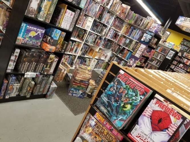 Comic book store in Cornelius Parker Banner Kent and Wayne
